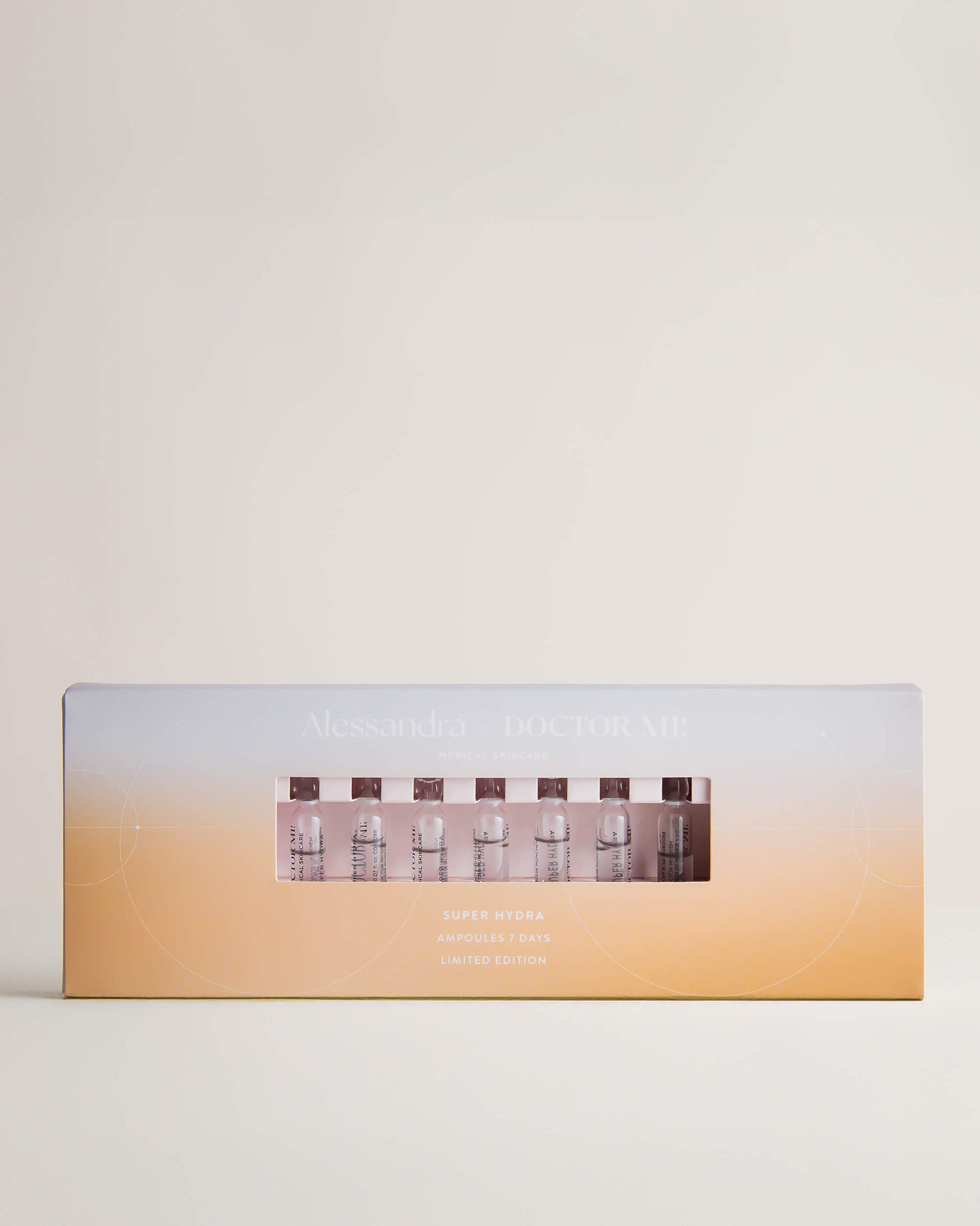 DOCTOR MI! SUPER HYDRA AMPOULES intensive Feuchtigkeit Ampullen für eine starke Hautbarriere und intensive Pflege in gelb blauer spezial Verpackung auf grauem Hintergrund