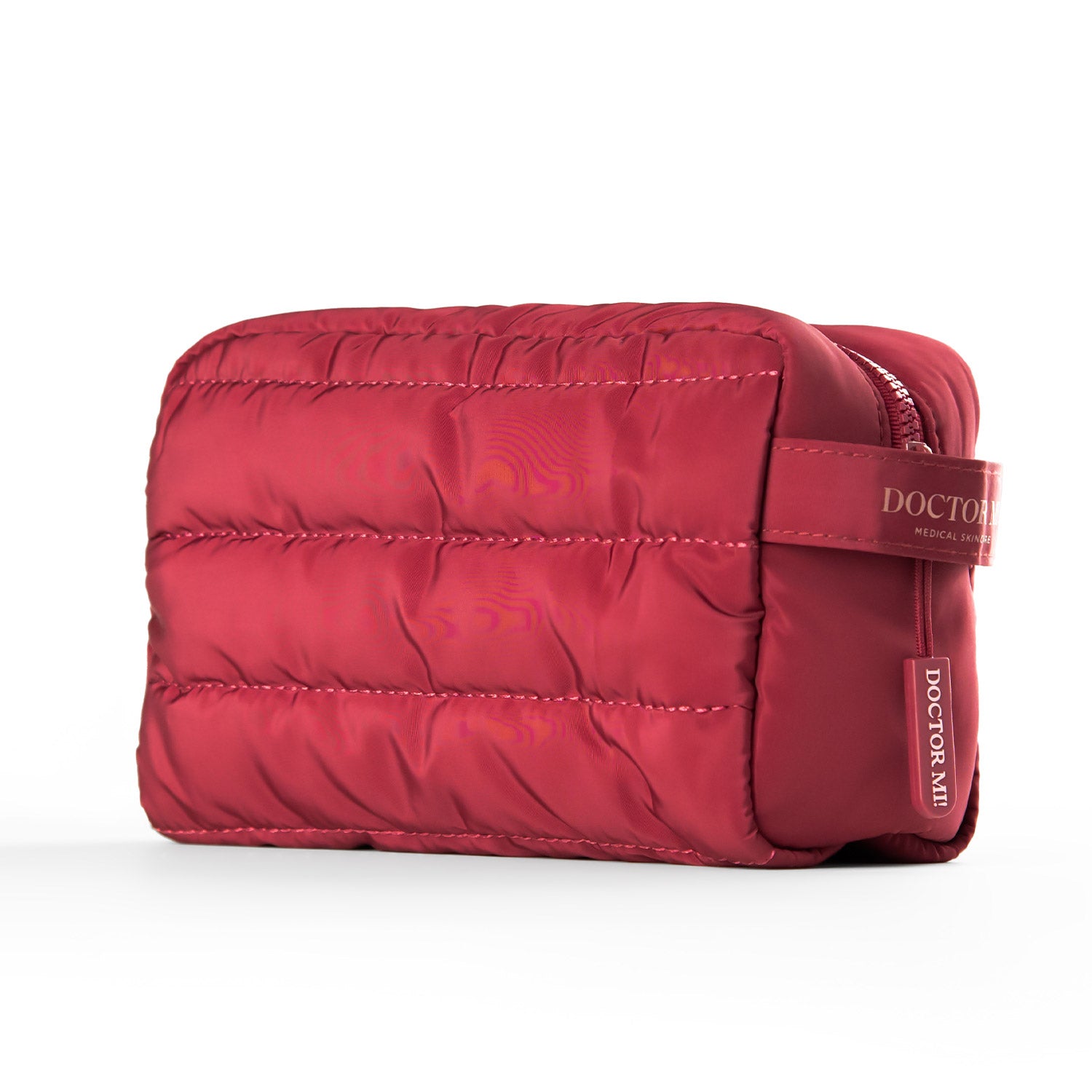 DOCTOR MI! BAG PUFFY RED praktische Kosmetiktasche in roter Steppoptik auf grauem Hintergrund